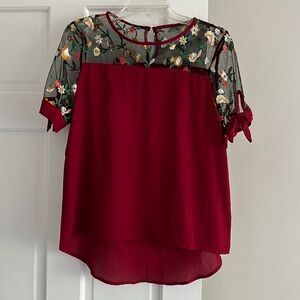 Maroon blouse with embroidery detail and tie sleeves